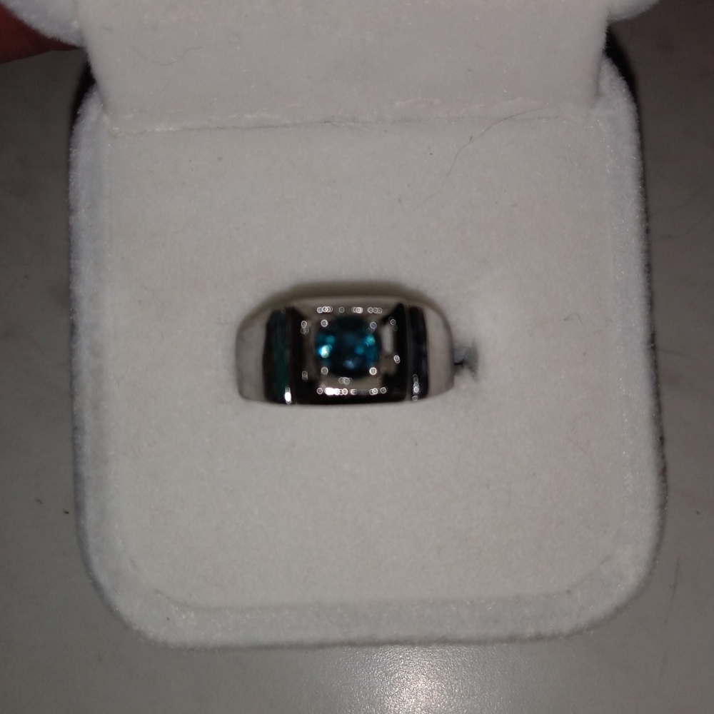 Beautiful and unique teal sapphire ring